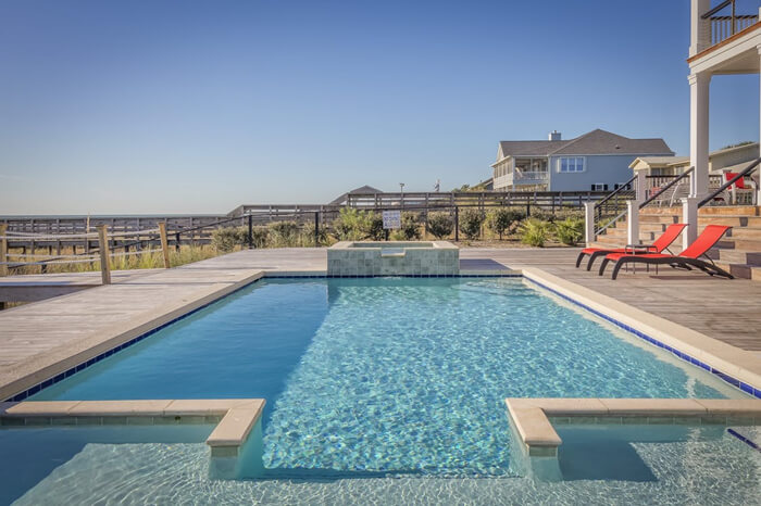 outdoor lap pool with fountain and walk in.jpg