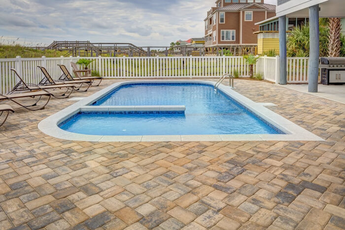 outdoor lap pool with bricks wrapped around.jpg