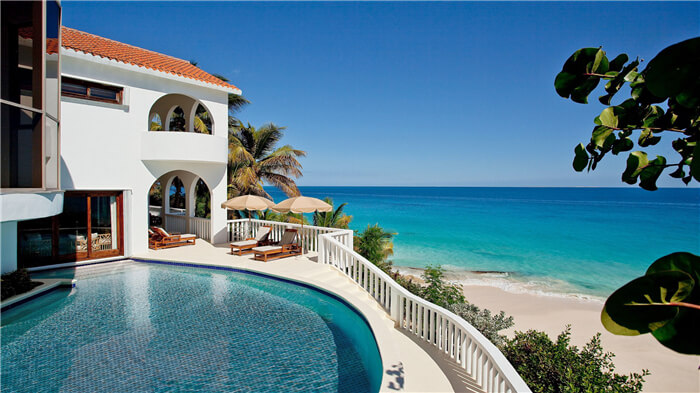 seaside villa swimming pool installed with glass made dark pool mosaic tiles.jpg