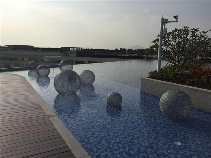 outdoor pool using blue mixed mosaic pool tiles.jpg