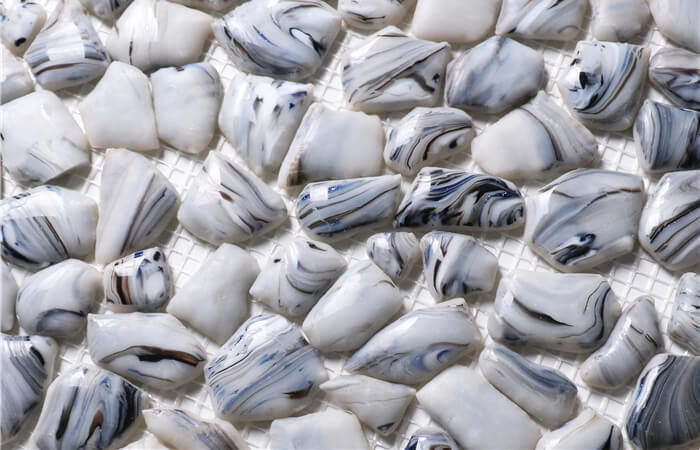 using artificial grey pebbles instead of pool tile for natural pool walk in.jpg