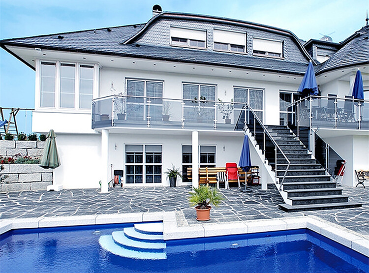 ocean-like villa pool with 2 inch dark blue triangle glass pool tiles.jpg