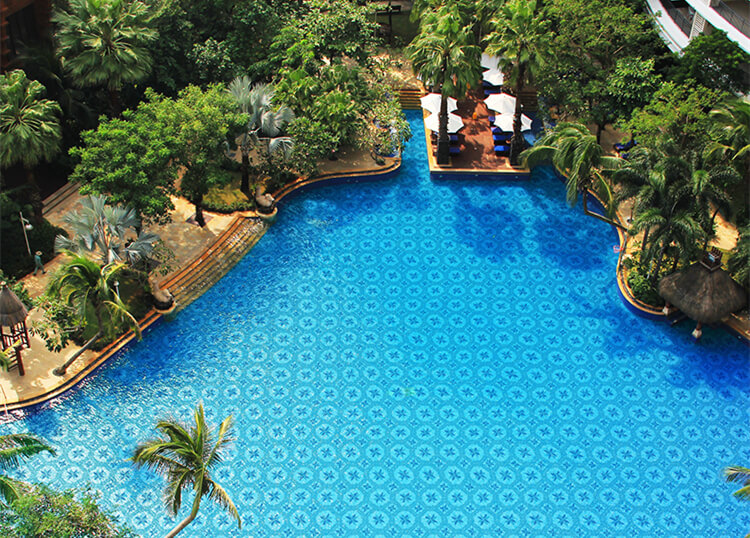 tropical pool area with geometric triangle pool mosaic tiles.jpg