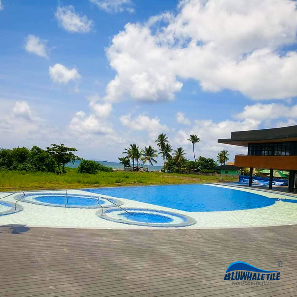 a hotle pool with ceramic pool tile