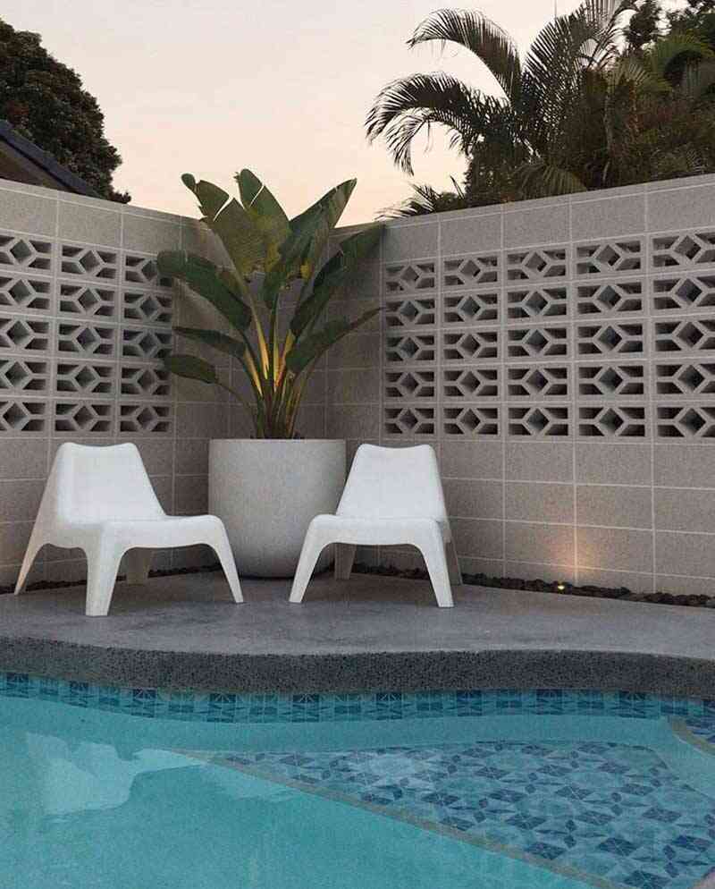 backyard renovation project with triangle pool tiles
