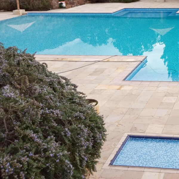 natural stone tiles as pool deck