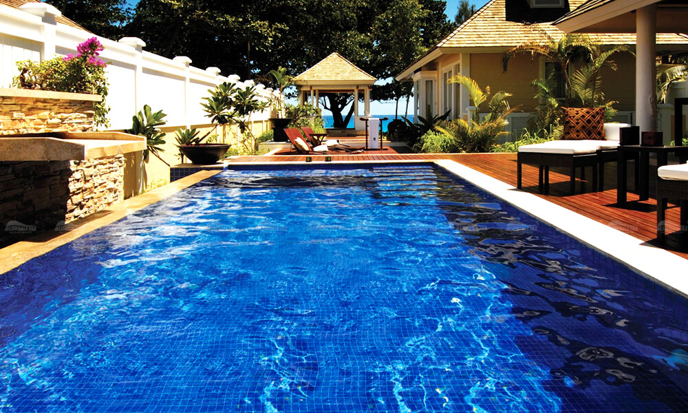 backyard swimming pool design with blue pool tile