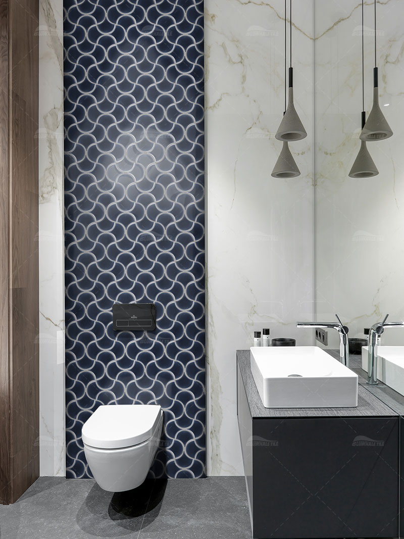 bathroom wall with dark blue fan tile